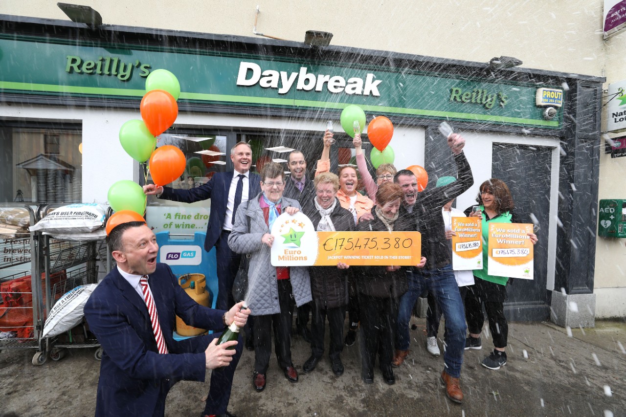 NOREPRO FEE: 20th Feb 2019. Les Reilly, Owner of Reilly’s Daybreak Store Main Street, Naul, North County Dublin celebrates pictured with staff and customers as David Woods (left) area rep with the National Lottery sprays the Champagne as celebrations get underway in the village of the Naul. Pic: Mac Innes Photography