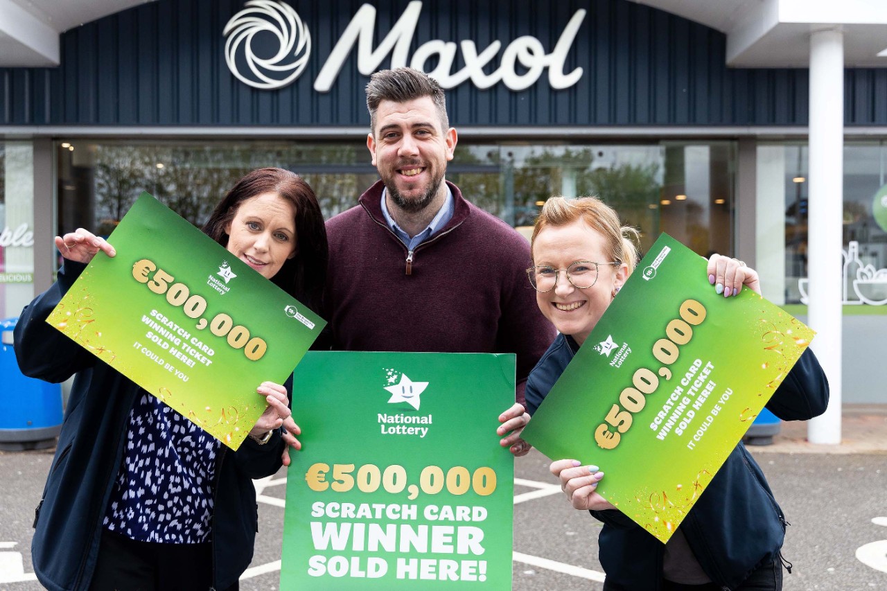 27/04/2023 - REPRO FREE - Staff at Herlihy’s Maxol store in Ballincollig, Co. Cork celebrate after it was confirmed that their shop sold the winning All Cash Extravaganza scratch card worth €500,000. Maxol Team members, Tracy O'Connor; Ian Leahy (Manager), and Sylwia Gospodinova, pictured at Maxol, Westend, Ballincollig, Cork. Picture: Michael O'Sullivan /Mac Innes Photography