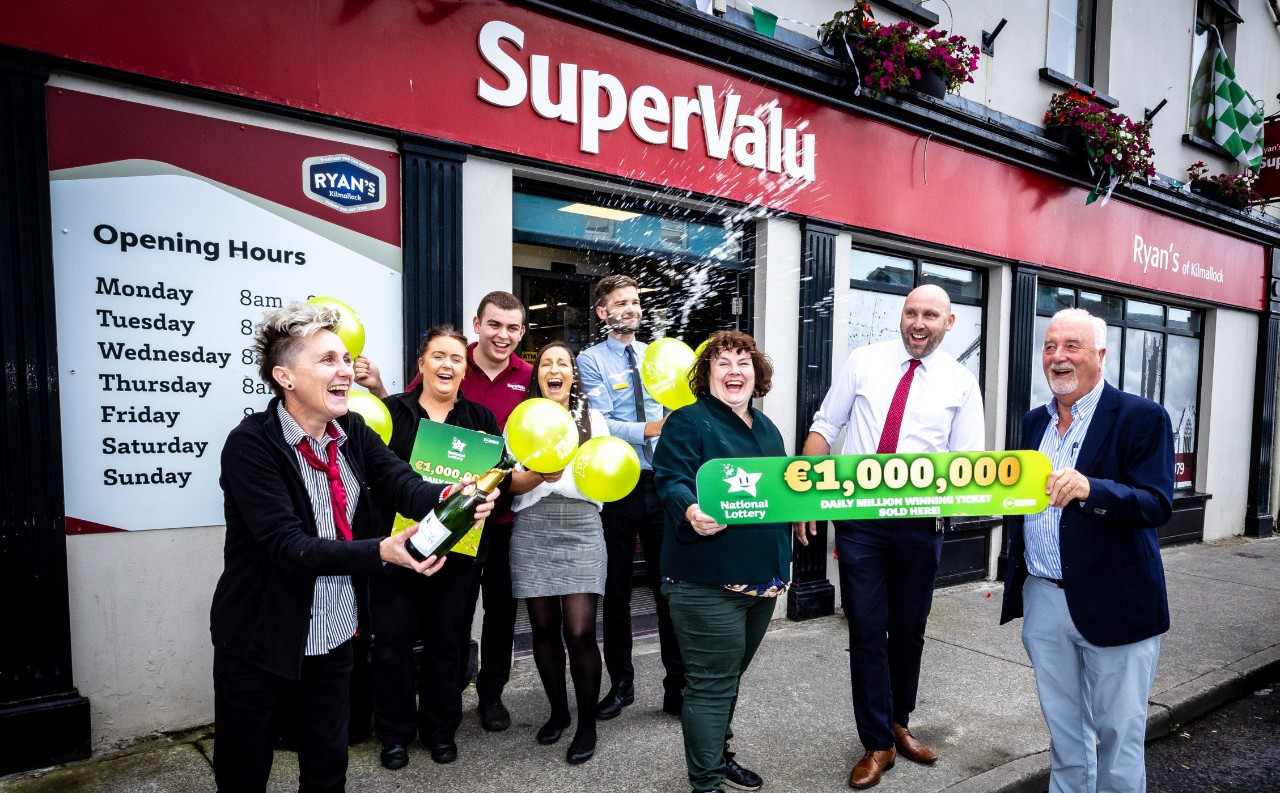 04-07-2023 LOTTO Ryans SuperValu Kilmallock celebrate a 1000000 Euro winning ticket in the Lotto Draw on 30th of June. Catriona Kelly, Michelle McGuire, Conor Finn, Roisin Howard, Garreth Davies, Store Manager, Joe Hay and Liam Ryan, Owner of Ryans SuperValu pictured here with Mary Grace, LOTTO Field sales Representative.  Picture: Keith Wiseman / Mac Innes Photography