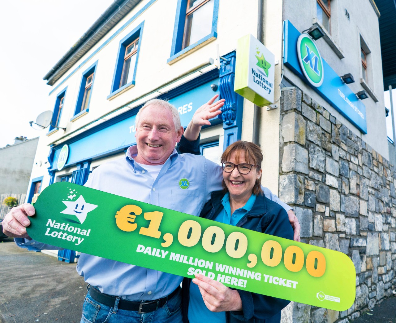NO REPRO FEE. 4th November 2022. A small local shop in the Turlough area in Co. Mayo has been revealed as the selling location for Thursday’s (3rd October) Daily Million top prize ticket worth an amazing €1,000,000. The winning normal play ticket was sold on the day of the draw at Turlough Stores in Turlough, just outside Castlebar in Co. Mayo. Michael and Attracta Barrett pictured celebrating at the store today having sold the Daily Millions winning ticket. Pic. Keith Heneghan / Mac Innes Photography