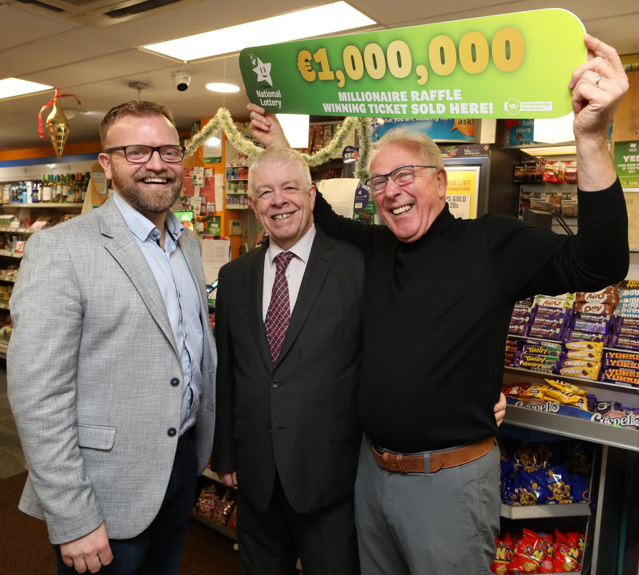No Repro Fee: 2nd January 2024. Kicking the year off with champagne celebrations at Mace Perrystown Dublin 12 after news that the New year’s Eve National Lottery, Millionaire Raffle €1 million winning ticket was bought at the shop. Shop owner Sean Mooney (right) pictured as celebrations got underway with Simon Reenan (left) and Sheamus Robinson, Mace .  Pic: Mac Innes Photography