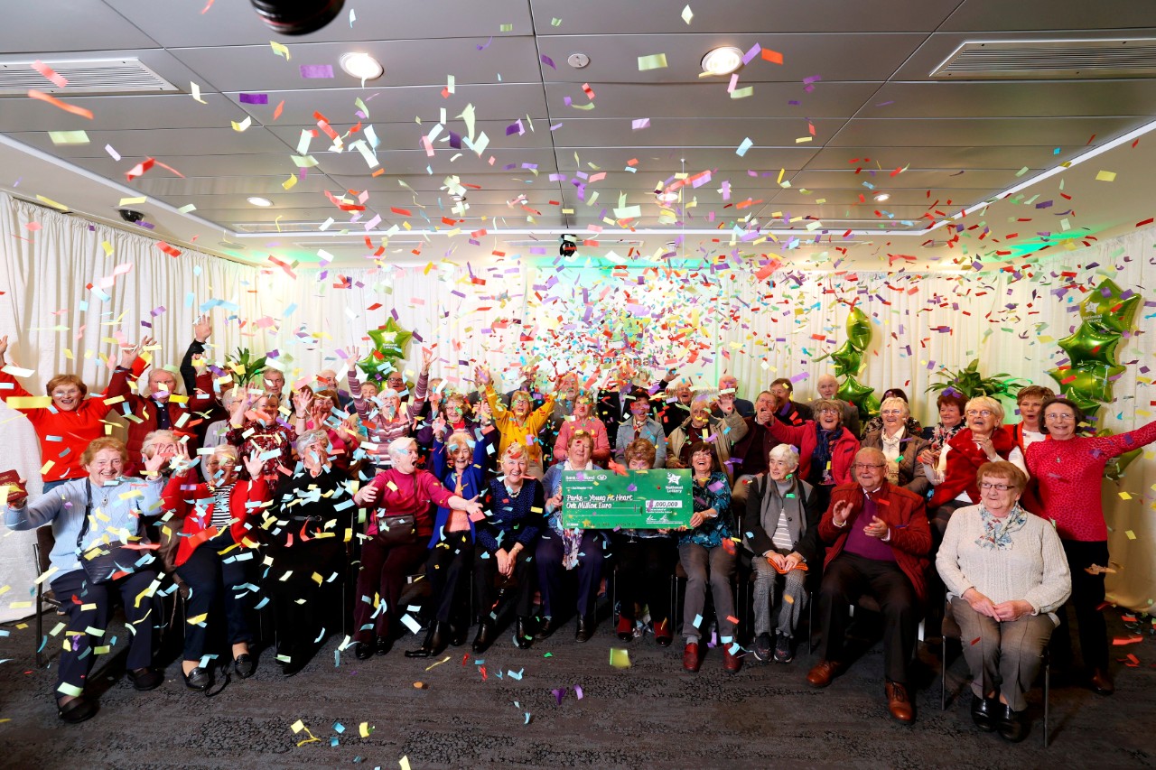 Repro Free: Monday 21st November 2022; The Green and Red of Mayo was belted out in song today at National Lottery HQ when a syndicate of 47 claimed their Daily Million worth an amazing  1,000,000. The syndicate are from a retirement group called Young at Heart, based in Parke Located near Turlough just outside Castlebar, Co. Mayo. Picture Jason Clarke/MacInness Photography.