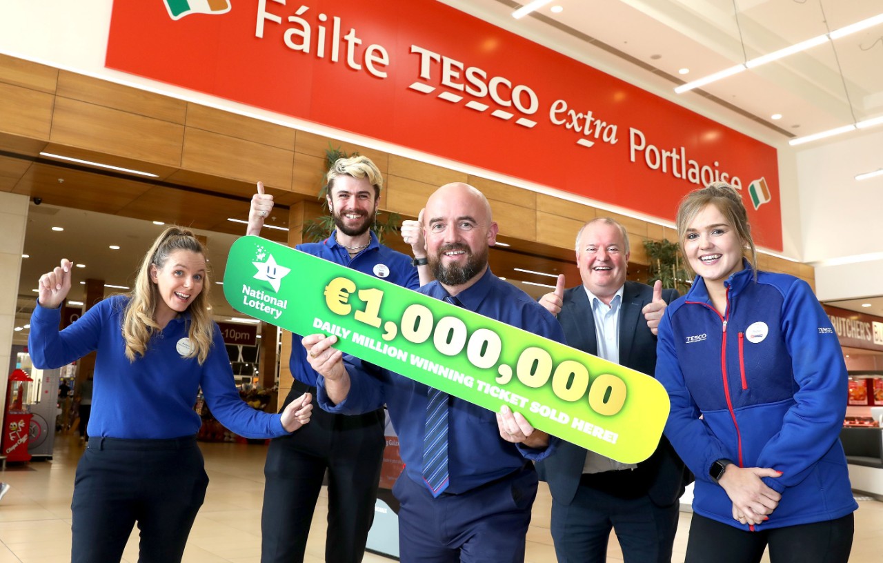 2th July 2022 NO REPRO FEE: Staff at Tesco Portlaoise in Co.Laois were overjoyed to hear that their shop sold the top prize €1 million winning ticket for Sunday’s (10th July) 2pm Daily Million draw. Maggie Fogarty, Thomas McRedmond, Graham Doyle, and Rachael Dollard celebrate with John Williams ( 2nd From right) from the National Lottery.  Pic: Mac Innes Photography